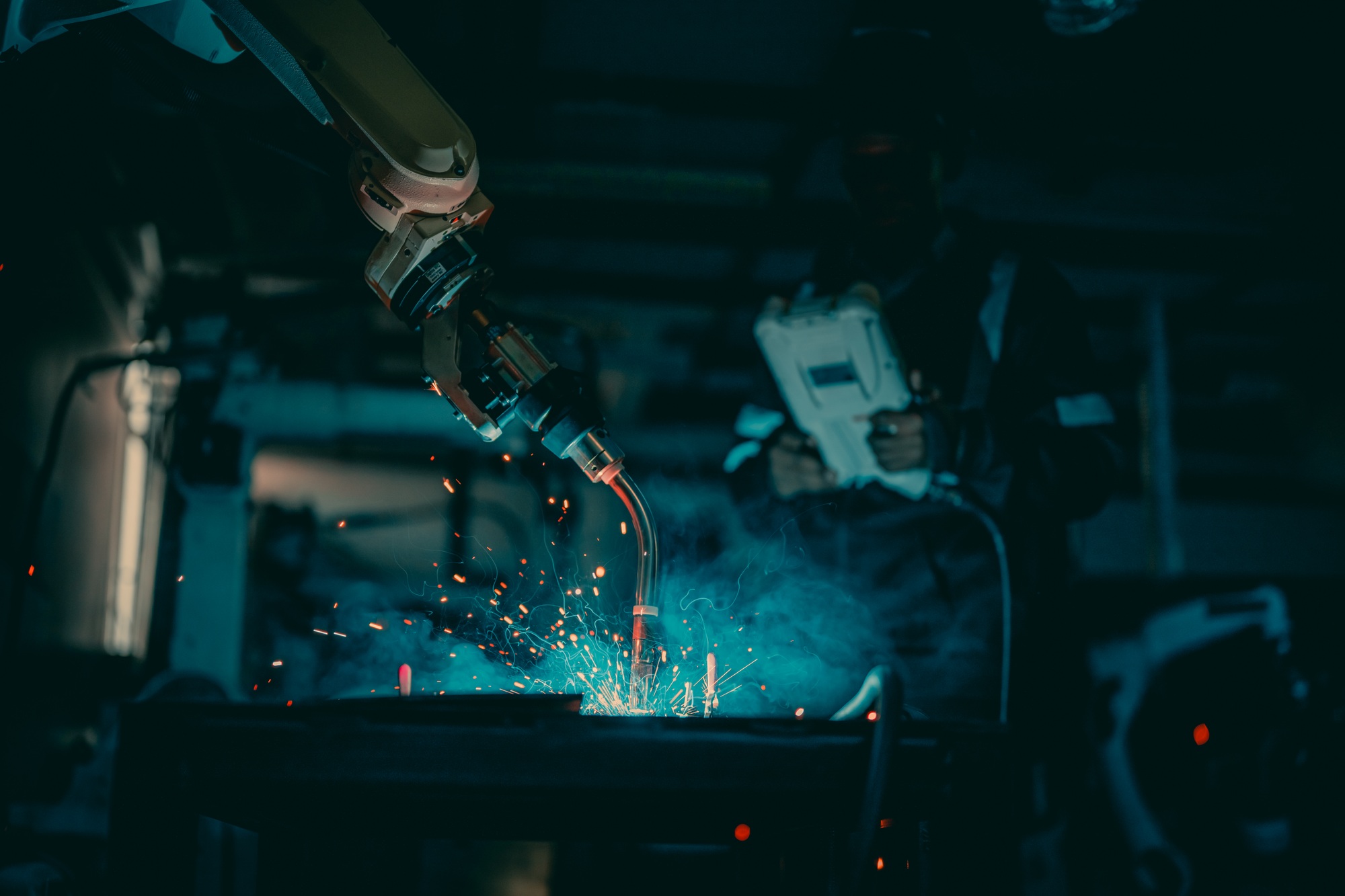 Metal welder specialist working with arc welding machine